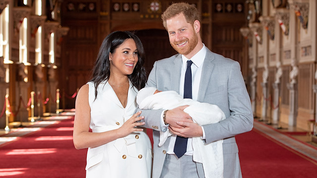 Britain's Prince Harry and Meghan, Duchess of Sussex are seen with their baby son, who was born on Monday morning, during a photocall in St George's Hall at Windsor Castle, in Berkshire, Britain May 8, 2019. Dominic Lipinski/Pool via REUTERS

