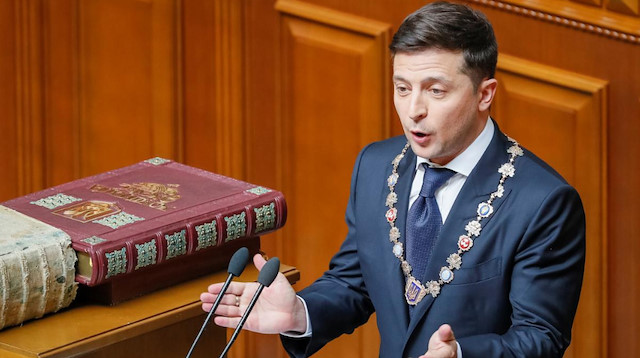 Ukraine's new President Volodymyr Zelenskiy applauds after taking the oath of office during his inauguration ceremony in the parliament hall in Kiev, Ukraine.