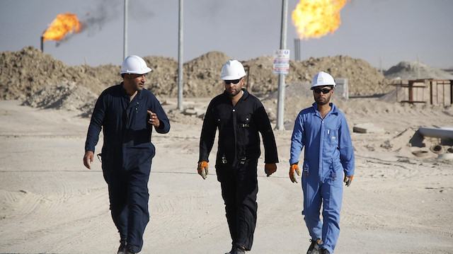 ExxonMobil'in Irak'ta çalışan personelleri.