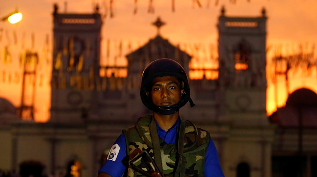 File photo: A security officer stands guard outside St. Anthony's Shrine, 