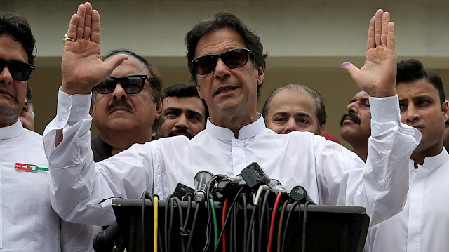 FILE PHOTO: Cricket star-turned-politician Imran Khan, chairman of Pakistan Tehreek-e-Insaf (PTI), speaks after voting in the general election in Islamabad, July 25, 2018. REUTERS/Athit Perawongmetha/File Photo

