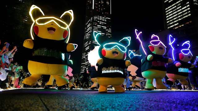 Performers wearing Pokemon's character Pikachu costumes take part in a night parade in Yokohama, Japan August 10, 2018. REUTERS/Kim Kyung-Hoon

