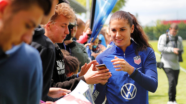File photo: United States forward Alex Morgan poses for photos with fans during training for the FIFA Women's World Cup France 2019 at Stade Louis Blério