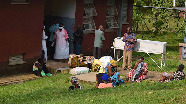 People are seen in the courtyard as Ugandan medical staff inspect the ebola preparedness facilities at the Bwera general hospital near the border with the Democratic Republic of Congo in Bwera, Uganda, 