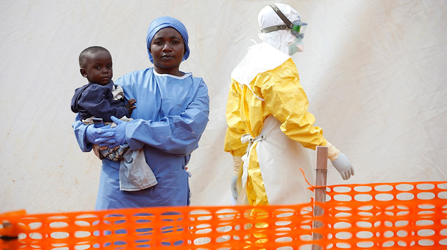 Mwamini Kahindo, an Ebola survivor working as a caregiver to babies 