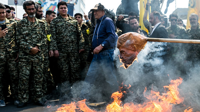 Iranians burn a mask of U.S. President Donald Trump during a protest marking the annual al-Quds Day (Jerusalem Day) on the last Friday of the holy month of Ramadan in Tehran, Iran May 31, 2019. Meghdad Madali/Tasnim News Agency/