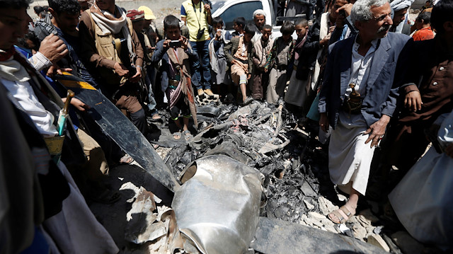 People gather around the engine of a drone aircraft which the Houthi rebels said they have downed in Sanaa, Yemen October 1, 2017. REUTERS/Khaled Abdullah

