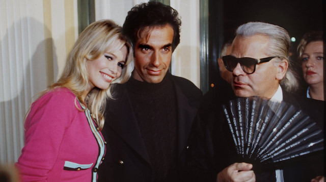 FILE PHOTO: Model Claudia Schiffer with David Copperfield at the opening night of David Copperfield's show "The Magic of David Copperfield" in Paris, France September 29. At right is fashion designer Karl Lagerfeld. Handout via REUTERS/File Photo

