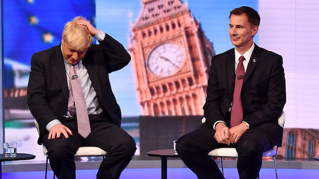 Boris Johnson and Jeremy Hunt appear on BBC TV's debate with candidates vying to replace British PM Theresa May, in London, Britain June 18, 2019. 