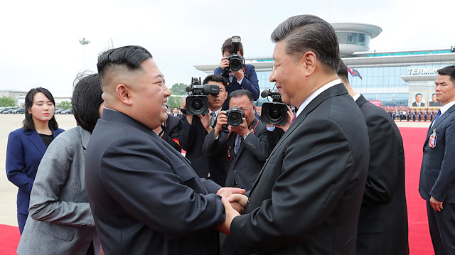 North Korean leader Kim Jong Un shakes hands with Chinese President Xi Jinping during Xi's visit in Pyongyang, North Korea, in this picture released by by North Korea's Korean Central News Agency