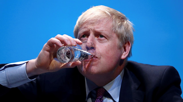 Boris Johnson, a leadership candidate for Britain's Conservative Party, drinks water as he attends a hustings event in Birmingham, Britain, June 22, 2019. REUTERS/Hannah McKay TPX IMAGES OF THE DAY

