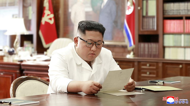 North Korean leader Kim Jong Un reads a letter from U.S. President Donald Trump, in Pyongyang, North Korea in this picture released by North Korea's Korean Central News Agency (KCNA)