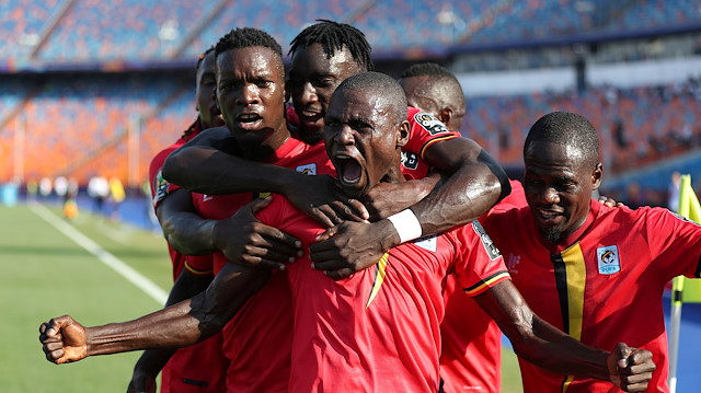Uganda's Patrick Kaddu celebrates scoring their first goal with team mates