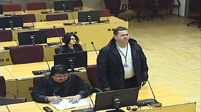 Ex-Serb soldier Sretko Pavic (standing) in court. 
