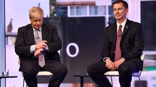 Boris Johnson and Jeremy Hunt appear on BBC TV's debate with candidates vying to replace British PM Theresa May, in London, Britain June 18, 2019. Jeff Overs/BBC/