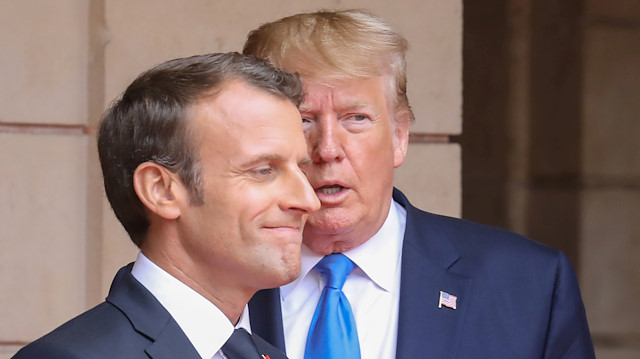 File photo: French President Emmanuel Macron speaks with U.S. President Donald Trump 