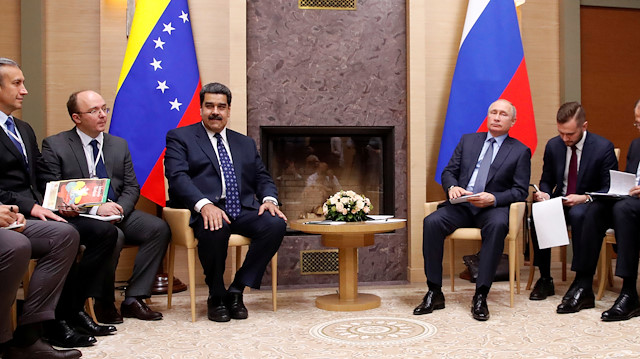 FILE PHOTO: Delegations, led by Russian President Vladimir Putin (5th R) and Venezuelan President Nicolas Maduro 

