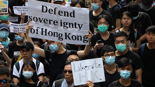 Hong Kong activists march to major international consulates in an attempt to rally foreign governments' support for their fight against a controversial extradition bill, in Hong Kong, China June 26, 2019.