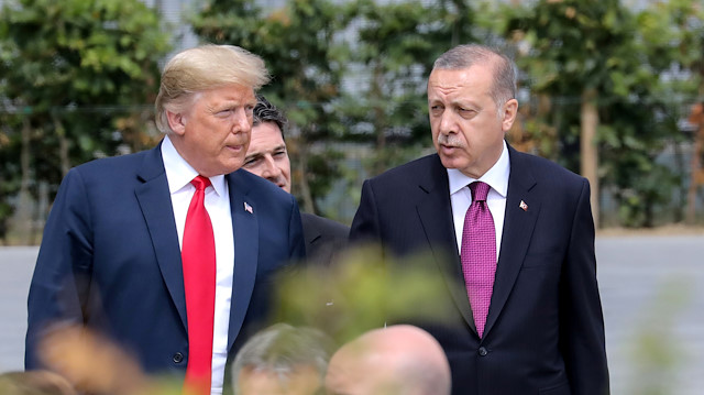 FILE PHOTO: U.S. President Donald Trump speaks withh Turkey's President Tayyip Erdogan ahead of the opening ceremony of the NATO (North Atlantic Treaty Organization) summit, at the NATO headquarters in Brussels, Belgium, July 11, 2018. Ludovic Marin/Pool via REUTERS/File Photo  