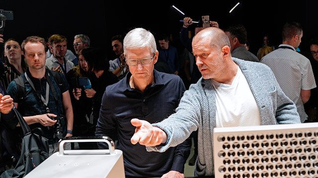 File photo: Apple CEO Tim Cook and Chief Design Officer Jonathan Ive (R) look over the new Mac Pro during Apple's annual Worldwide Developers Conference in San Jose, California, U.S. June 3, 2019