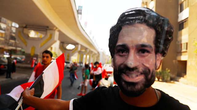 Soccer Football - Africa Cup of Nations 2019 - Group A - Egypt v Zimbabwe - Cairo International Stadium, Cairo, Egypt - June 21, 2019 An Egypt fan wearing a Mohamed Salah mask outside the stadium before the match REUTERS/Amr Abdallah Dalsh

