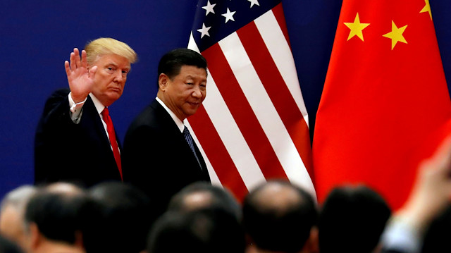 File photo: U.S. President Donald Trump and China's President Xi Jinping meet business leaders at the Great Hall of the People in Beijing, China