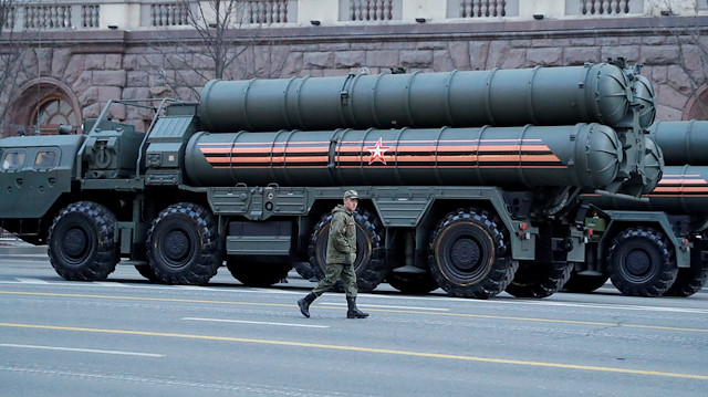  Russian serviceman walks past S-400 missile air defence systems 