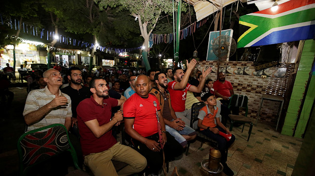 Soccer Football - Africa Cup of Nations 2019 - Round of 16 - Egypt v South Africa - Cairo, Egypt July 6, 2019. Egyptians react as they watch a telecast of Egypt playing against South Africa at cafe in Cairo, Egypt July 6, 2019. REUTERS/Hayam Adel

