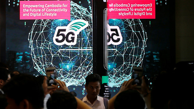 People attend a 5G launching ceremony at the Smart Axiata Telecommunications company in Phnom Penh, Cambodia July 8, 2019.