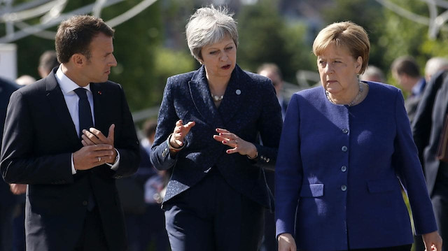 Emmanuel Macron, Theresa May, Angela Merkel