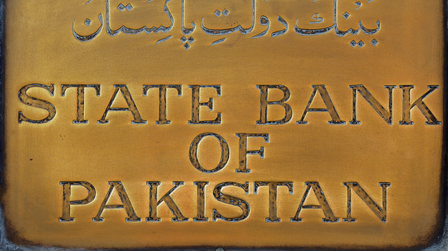 FILE PHOTO: A brass plaque of the State Bank of Pakistan is seen outside of its wall in Karachi, Pakistan December 5, 2018. REUTERS/Akhtar Soomro/File Photo

