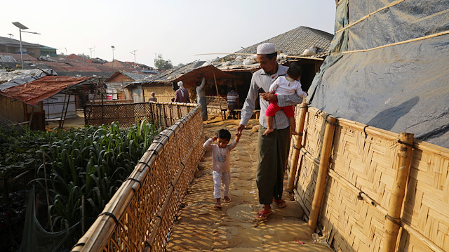 File photo: A Rohingya refugee man walks with his children at Balukhali camp in Cox's Bazar