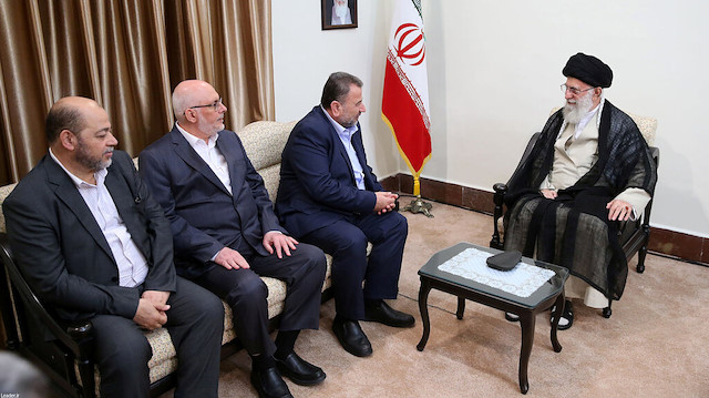 Iran's Supreme Leader Ayatollah Ali Khamenei meets with Hamas deputy Saleh Arour