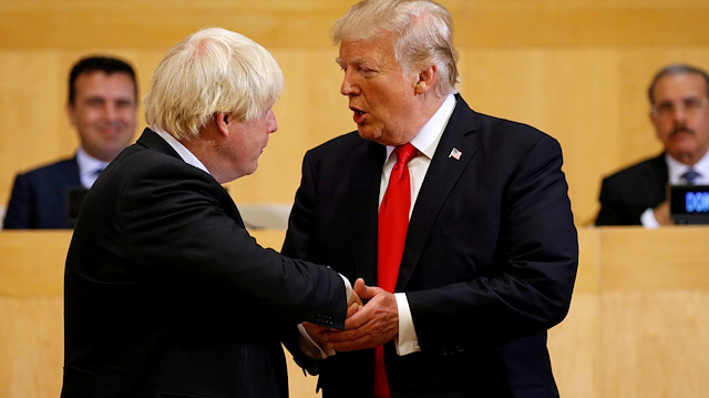 FILE PHOTO: U.S. President Donald Trump shakes hands with British Foreign Secretary Boris Johnson (L) as they take part in a session on reforming the United Nations at U.N. Headquarters in New York, U.S., September 18, 2017. REUTERS/Kevin Lamarque/File Photo  