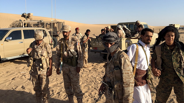 A group of soldiers trained by Emirati and Gulf Arab forces along with Yemeni tribesmen gather near a military base in the Yemeni frontline province of Marib in this September 14, 2015 file photo. As Gulf Arab troops push through Yemen's central desert into the mountains that lead to the capital held by the Houthis, their Iran-allied foe, winning the hearts and minds of the heavily armed tribes who rule in this area is essential. To match story YEMEN-SECURITY/MARIB REUTERS/Noah Browning/Files

