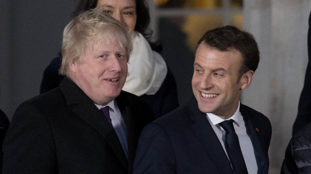 Britain's Foreign Secretary Boris Johnson and France's President Emmanuel Macron