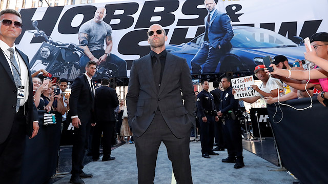 Cast member and producer Jason Statham greets fans at the premiere for "Fast & Furious Presents: Hobbs & Shaw" in Los Angeles, California, U.S., July 13, 2019.