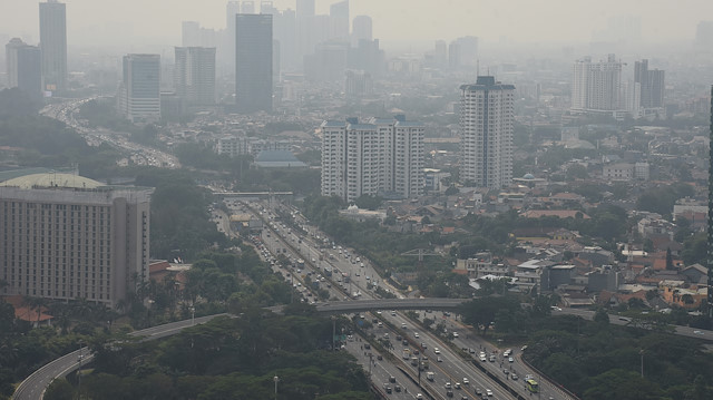 A general view of buildings as smog covers the capital city of Jakarta, Indonesia, July 29, 2019 in this photo taken by Antara Foto. Picture taken July 29, 2019 Antara Foto/Indrianto Eko Suwarso/ via REUTERS ATTENTION EDITORS - THIS IMAGE WAS PROVIDED BY A THIRD PARTY. MANDATORY CREDIT. INDONESIA OUT.  