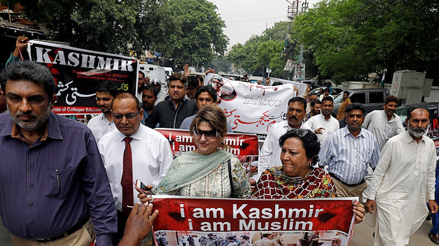 File photo: Demonstrators hold signs and chant slogans as they march in solidarity with the people of Kashmir, during a rally in Karachi, Pakistan 