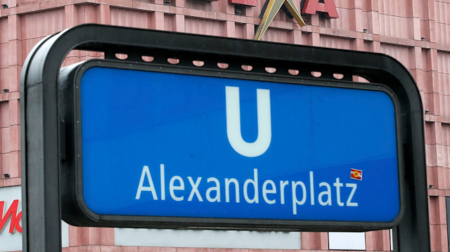 An entrance to the subway is pictured next to a sign of Alexia shopping mall at Alexanderplatz 