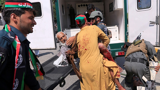  Men carry a wounded person to the hospital after a blast in Jalalabad, Afghanistan August 19, 2019. REUTERS/Parwiz

