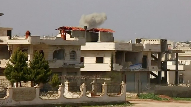 Heavy smoke rises from a building after an air strike on location targeted by government forces, in Khan Sheikhoun, Idlib, Syria February 26, 2019, in this still image taken from video. ReutersTV/