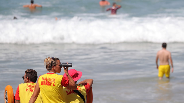 Lifeguards watch swimmers at the beach ahead of the G7 summit in Biarritz, France, August 23, 2019. 