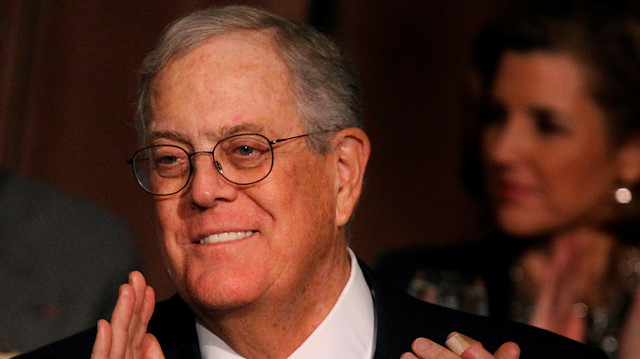 FILE PHOTO: David Koch, executive vice president of Koch Industries, applauds during an Economic Club of New York event in New York, December 10, 2012. REUTERS/Brendan McDermid/File Photo

