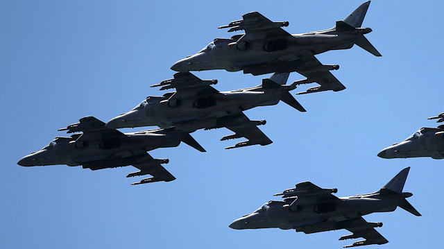 Five AV-8B Harrier jets from the Spanish Navy fly during an international aerial and naval military exhibition commemorating the centennial of the Spanish Naval Aviation, over a beach near the naval airbase in Rota, southern Spain, September 16, 2017. REUTERS/Jon Nazca

