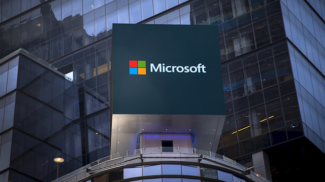 The Microsoft logo is seen on an electronic billboard on an office building in New York City.