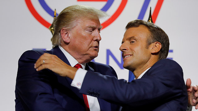 French President Emmanuel Macron greets U.S. President Donald Trump after a joint press conference at the end of the G7 summit in Biarritz, France, August 26, 2019. REUTERS/Philippe Wojazer  
