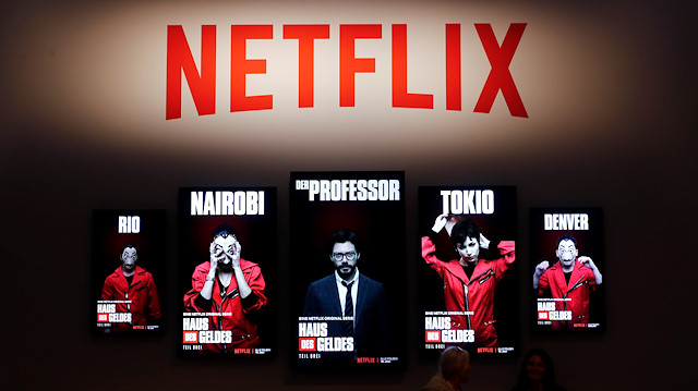 The Netflix series Money Heist is advertised at the booth of Netflix during Europe's leading digital games fair Gamescom, which showcases the latest trends of the computer gaming scene in Cologne, Germany, August 21, 2019. REUTERS/Wolfgang Rattay  