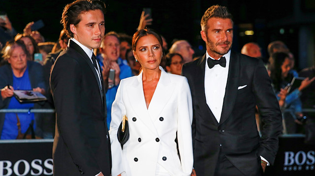 David Beckham, his wife Victoria Beckham and one of their sons, Brooklyn Beckham arrive to the GQ Men Of The Year Awards 2019 in London, Britain September 3, 2019. REUTERS/Henry Nicholls

