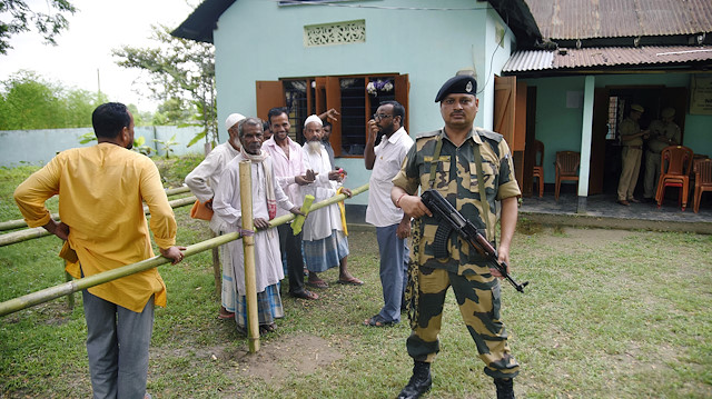 File photo: People stand in a queue to check their names on the draft list of the National Register of Citizens (NRC) outside an NRC centre in Rupohi village, Nagaon district, northeastern state of Assam, India